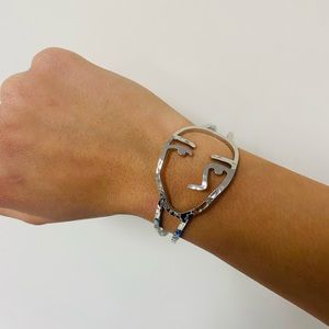 Abstract face silver bracelet